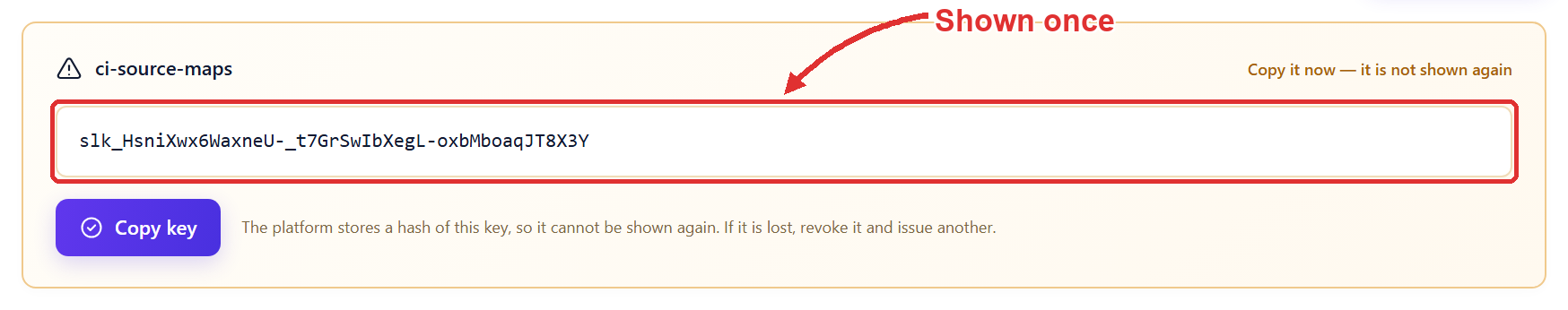 The new key ci-source-maps shown in full once in a highlighted box, outlined, with an arrow labelled Shown once, a Copy key button, and the note that the platform stores a hash so it cannot be shown again