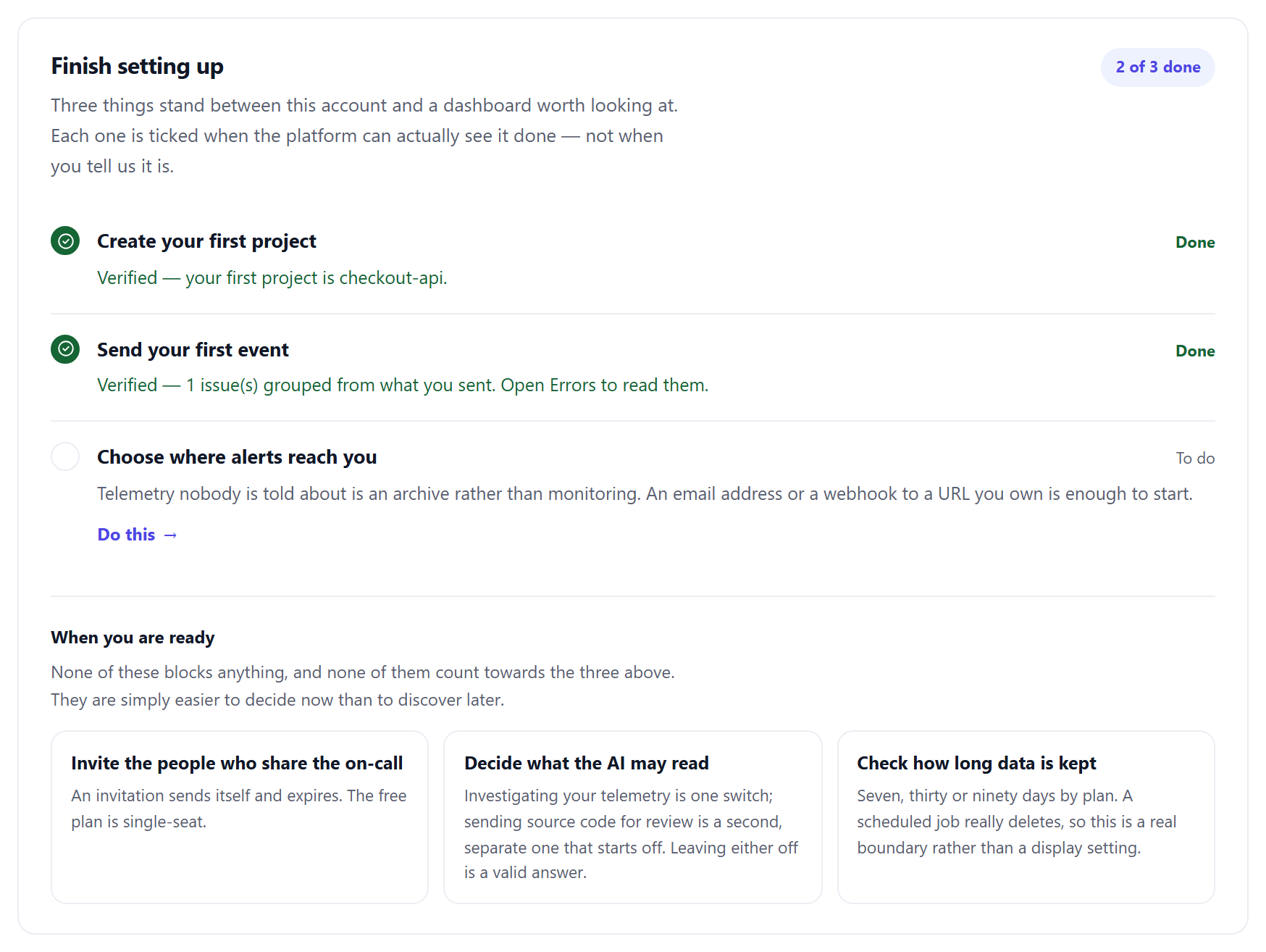 The checklist at 2 of 3 done: Create your first project marked Done with “Verified — your first project is checkout-api”, Send your first event marked Done with “Verified — 1 issue(s) grouped from what you sent”, and Choose where alerts reach you still to do